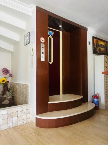a entrance to a waiting room with a door at Albayrak Hotel in Çeşme