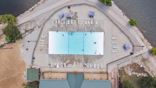 an overhead view of a swimming pool on a beach at Baldknobber Ridge Escape - West Branson Cabin in Branson West