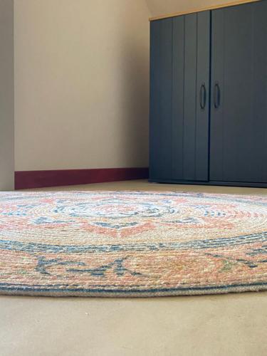 a room with a rug on the floor next to a door at La Jura in Podlesice