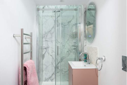 a bathroom with a shower and a sink at La Casita in Breage