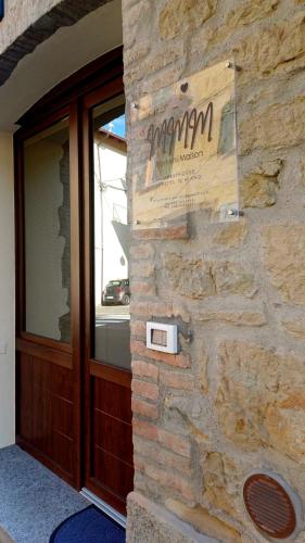 a sign on the side of a building at My Mini Maison in Castel dʼAiano