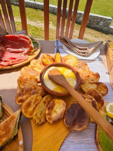 a table with a plate of food with eggs and bread at Bujtina Pepushaj Lepushe in Lëpushë