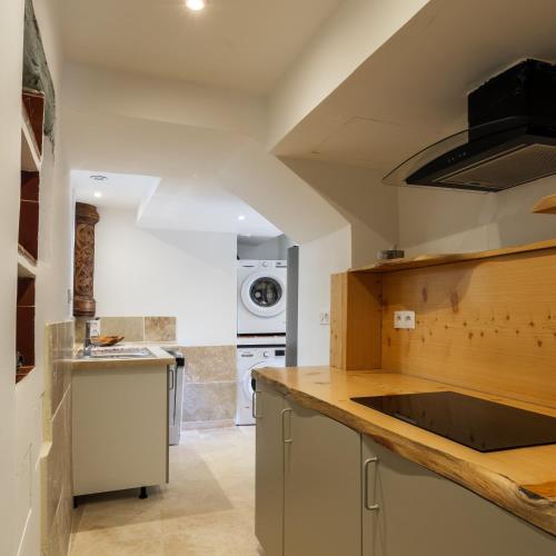 Una cocina o cocineta en Apt La Fontaine