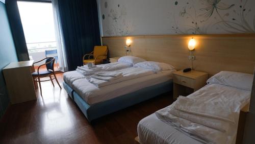 Postel nebo postele na pokoji v ubytování Aria Life Hotel