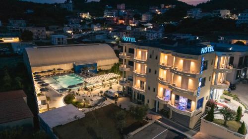 an aerial view of a hotel with a pool at night at Hotel Blue Moon in Ulcinj