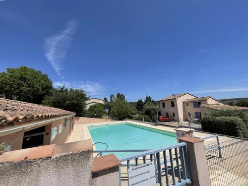 a view of a swimming pool from a balcony at Maison confortable avec jardin à Quinson - FR-1-822-2 in Quinson