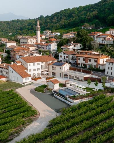 a view of a town with a vineyard at Agriturismo Prà dell'Ort - Wishing Wellness in Valdobbiadene