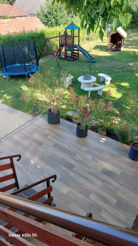 a park with a playground with a swing at Anno Apartman ll. in Balatonföldvár