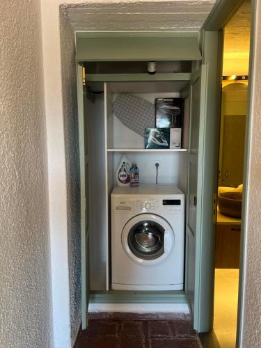 a washer and dryer in a small room at Gioma Garden Villas in Istron