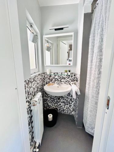 a bathroom with a sink and a mirror at Cinque Terre, Sea View Home in Manarola