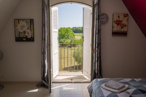 En eller flere senge i et værelse på Villa Coeur de Campagne