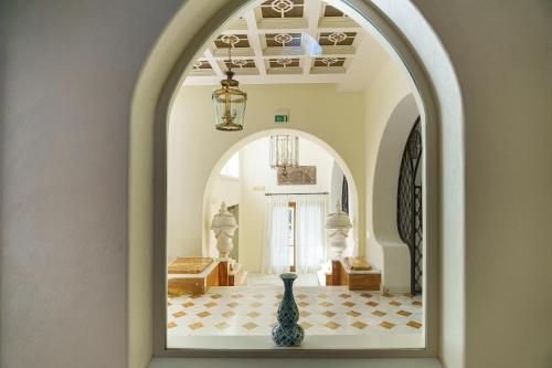 a vase sitting on a table in a hallway at Manzi Hotel & Spa in Ischia