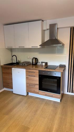 Η κουζίνα ή μικρή κουζίνα στο Apartamenty W Domu