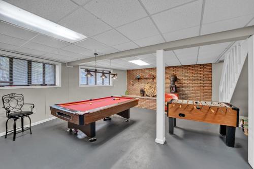 a room with a pool table and a ping pong ball at Liambear's Den in Lake Ariel