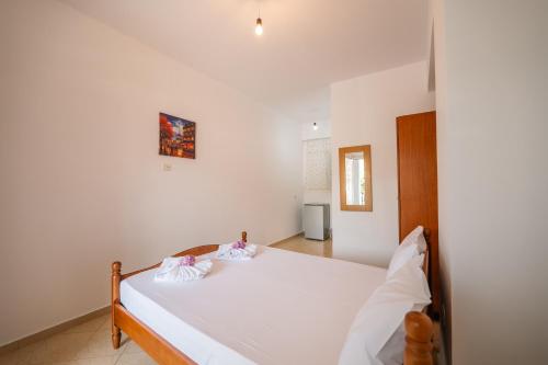 Ένα ή περισσότερα κρεβάτια σε δωμάτιο στο Athina Rooms