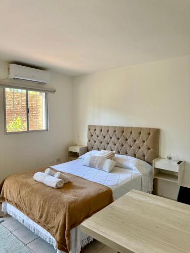 a bedroom with two beds and a window at Lo de Nacho in Canning
