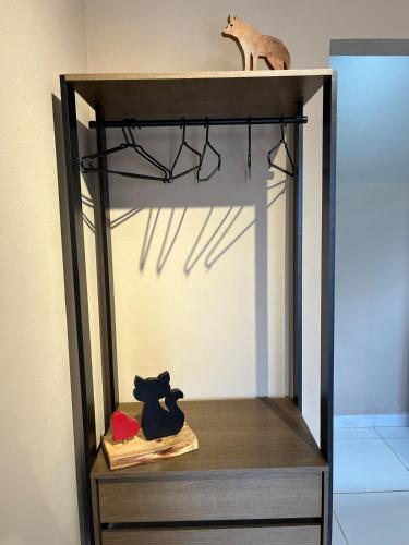 a shelf with two animals sitting on top of it at Cantim d' Casa in Catas Altas