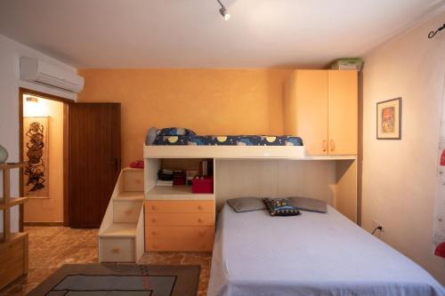 a bedroom with a bed and a bunk bed at Casa di Simone in Scandicci