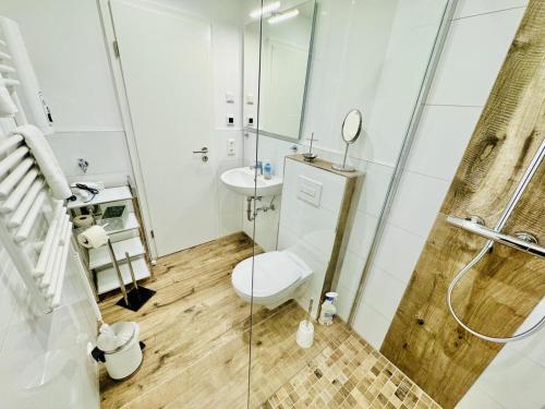 Ένα μπάνιο στο Ferienhaus Kliff-Haeuschen