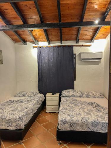 Cama o camas de una habitación en Hosteria El Castellano
