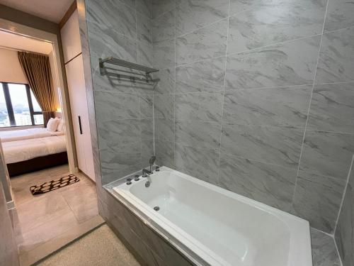 a bathroom with a bath tub in a room at Imperio Private Bathtub Melaka Town By MICASA GROUP in Melaka