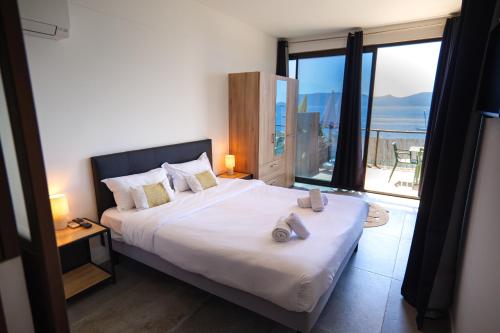 Ένα ή περισσότερα κρεβάτια σε δωμάτιο στο Hotel L'Escale