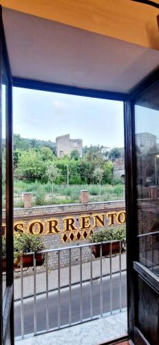 a window with a sign that reads northernonga at Appartamento Villa Bianca su "Corso ITALIA" in Sorrento