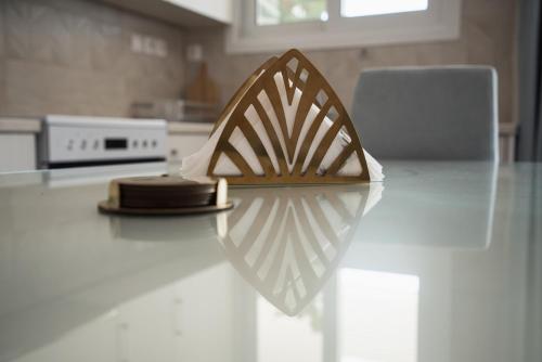 a counter top with a wooden utensil on it at Sofia Luxury Apartments in Lechaio