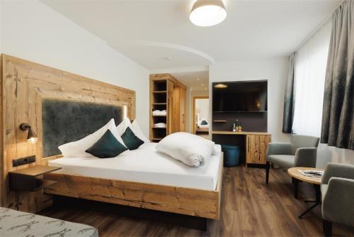Postel nebo postele na pokoji v ubytování Kohlerhof - 4 Star Wellness & Active Hotel