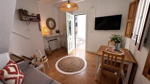 a living room with a couch and a table at Harmonia De La Mar in Altea