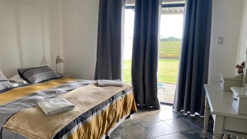 Una cama o camas en una habitación de The Foulds - Comfortable Cottage