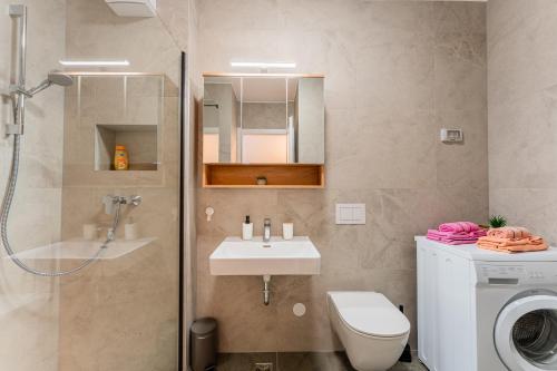 a bathroom with a shower toilet and a sink at Flex SelfCheckIns 142 - Zagreb - Bedroom - Garage - Loggia in Zagreb