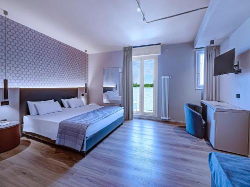 Postel nebo postele na pokoji v ubytování Hotel Excelsior