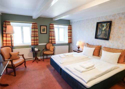 Postel nebo postele na pokoji v ubytování Hotel Dagmar