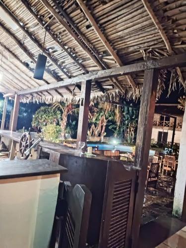 a bar with a view of the ocean at Indri Lodge in Andasibe