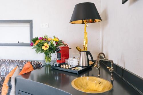 a counter with a sink and a lamp on it at Botel in Amsterdam