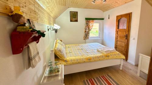 Postel nebo postele na pokoji v ubytování Casa Taraneasca "OM BUN"