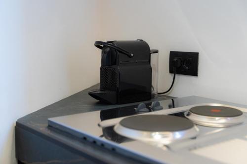 a stove top with a speaker on top of it at 5 Stars - Exclusive Luxury Suites with a jacuzzi in Trapani