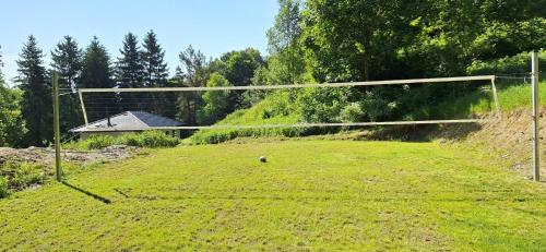 a soccer ball on a field with a goal at Chata Henry in Krásná