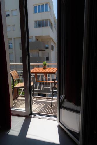 a view from a window of a balcony with a table at 5 Stars - Exclusive Luxury Suites with a jacuzzi in Trapani