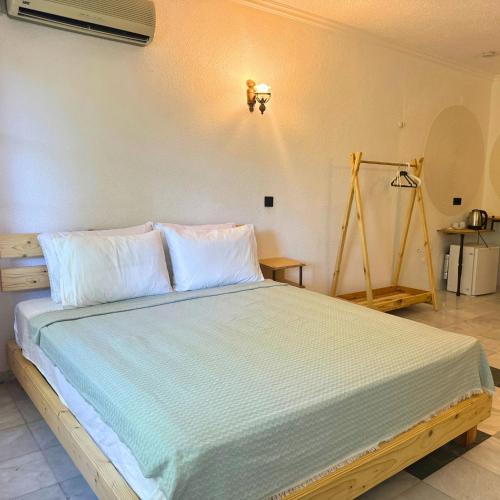 a bedroom with a large bed in a room at Club Mel Holiday in Ortaca