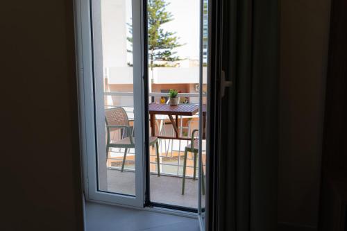 a view of a table and chairs from a window at 5 Stars - Exclusive Luxury Suites with a jacuzzi in Trapani