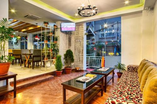 a living room with a couch and a table at Beautiful Kathmandu Hotel in Kathmandu