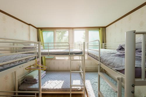 Postel nebo postele na pokoji v ubytování Panda Guesthouse