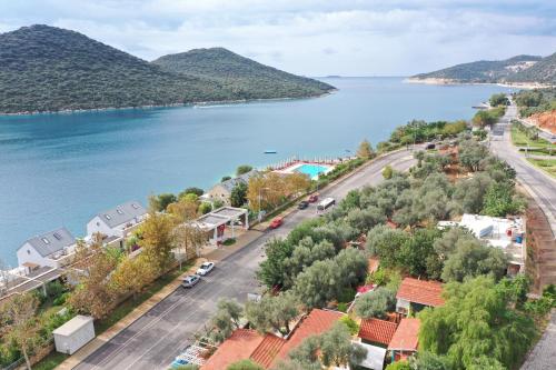 an aerial view of a town next to a body of water at Can Mocamp in Kas