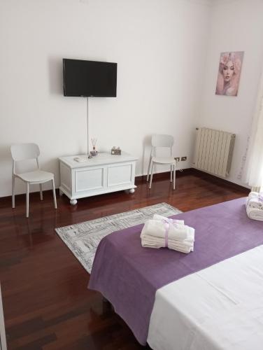 Ένα ή περισσότερα κρεβάτια σε δωμάτιο στο Fardella 75