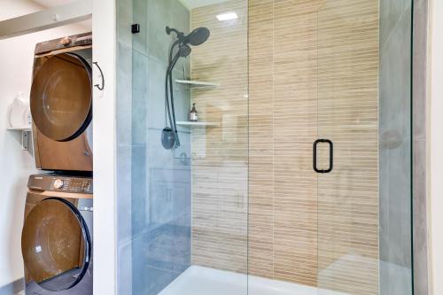 a shower with a glass door in a bathroom at 3 Mi to Lake Onalaska Quaint Home with Prairie View in Onalaska