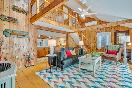 a living room with a couch and a table at Your Trail's End in Maine in Wayne