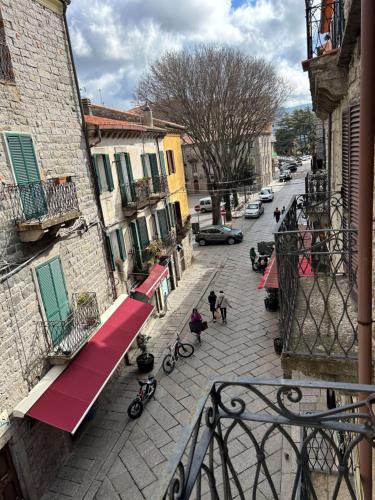 a view of a street from a balcony of a building at Camere del Corso in Tempio Pausania