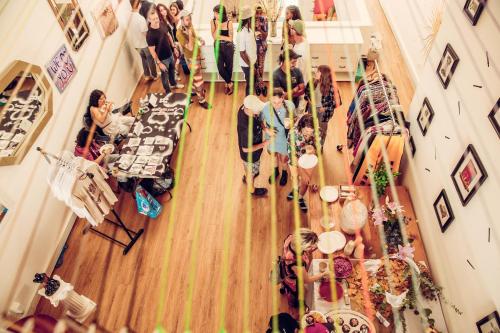 a group of people standing in a room at STAY OPEN Venice Beach in Los Angeles